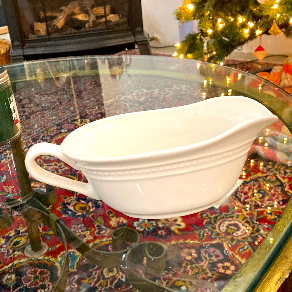 Ceramic gravy boat. Similar to Italian countryside. May be that but not marked.